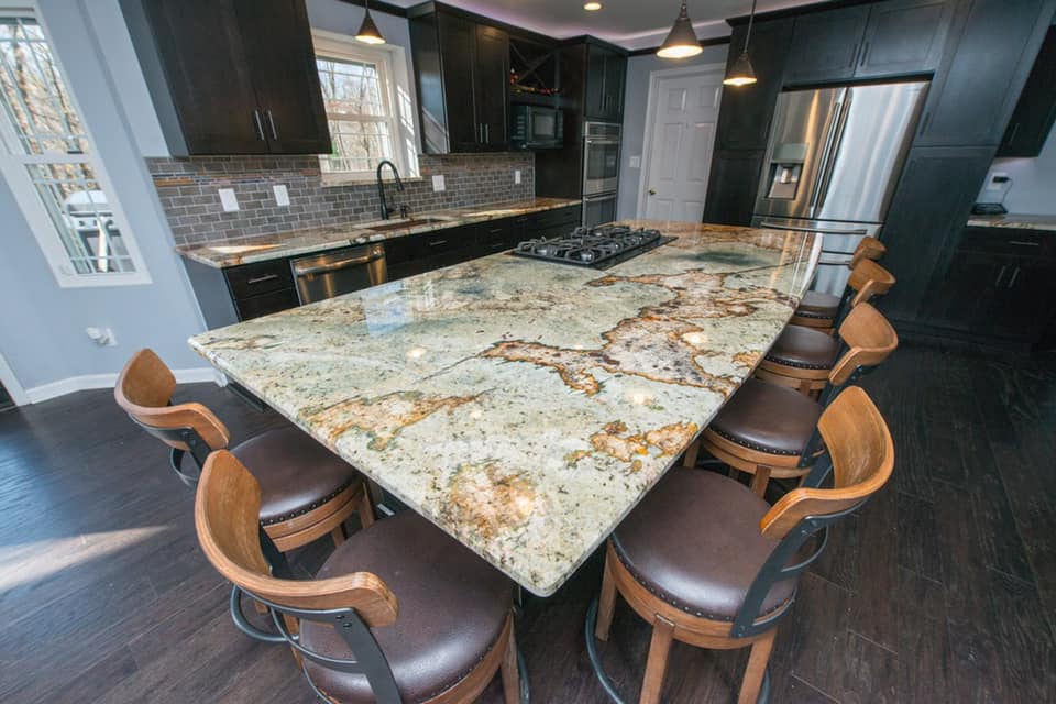 High angle view of a granite kitchen island with bar stools