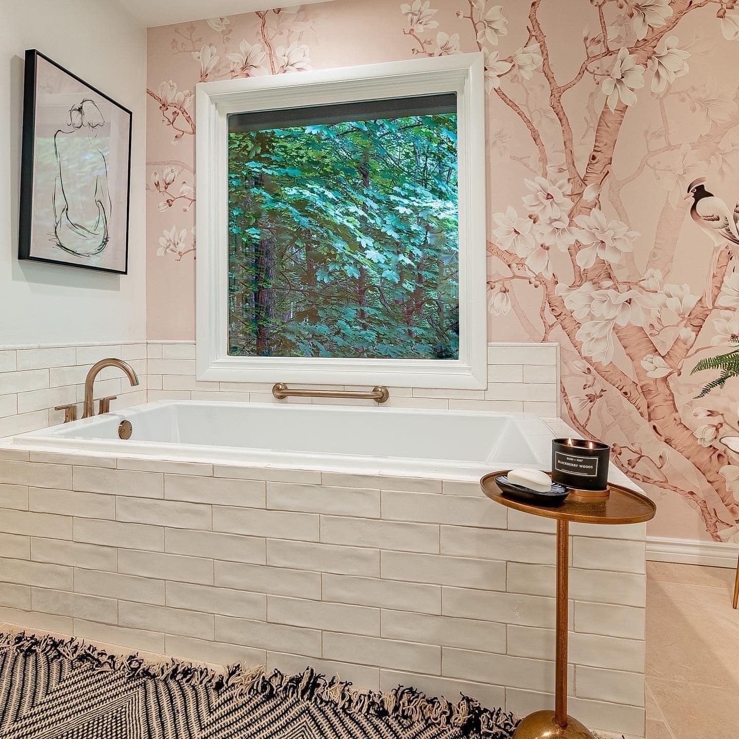 Bathtub area with white tile surround and floral patterned wallpaper behind in Oswego, NY